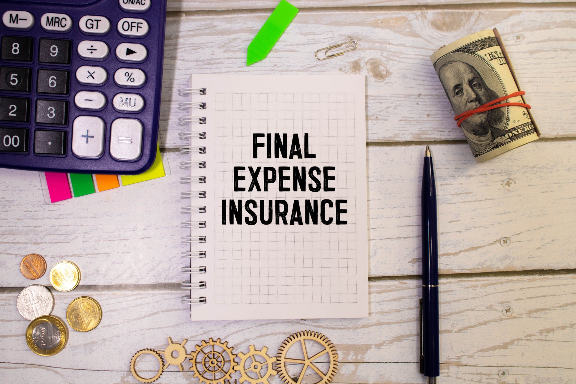 Final Expense Insurance write on a book isolated on Wooden Table.