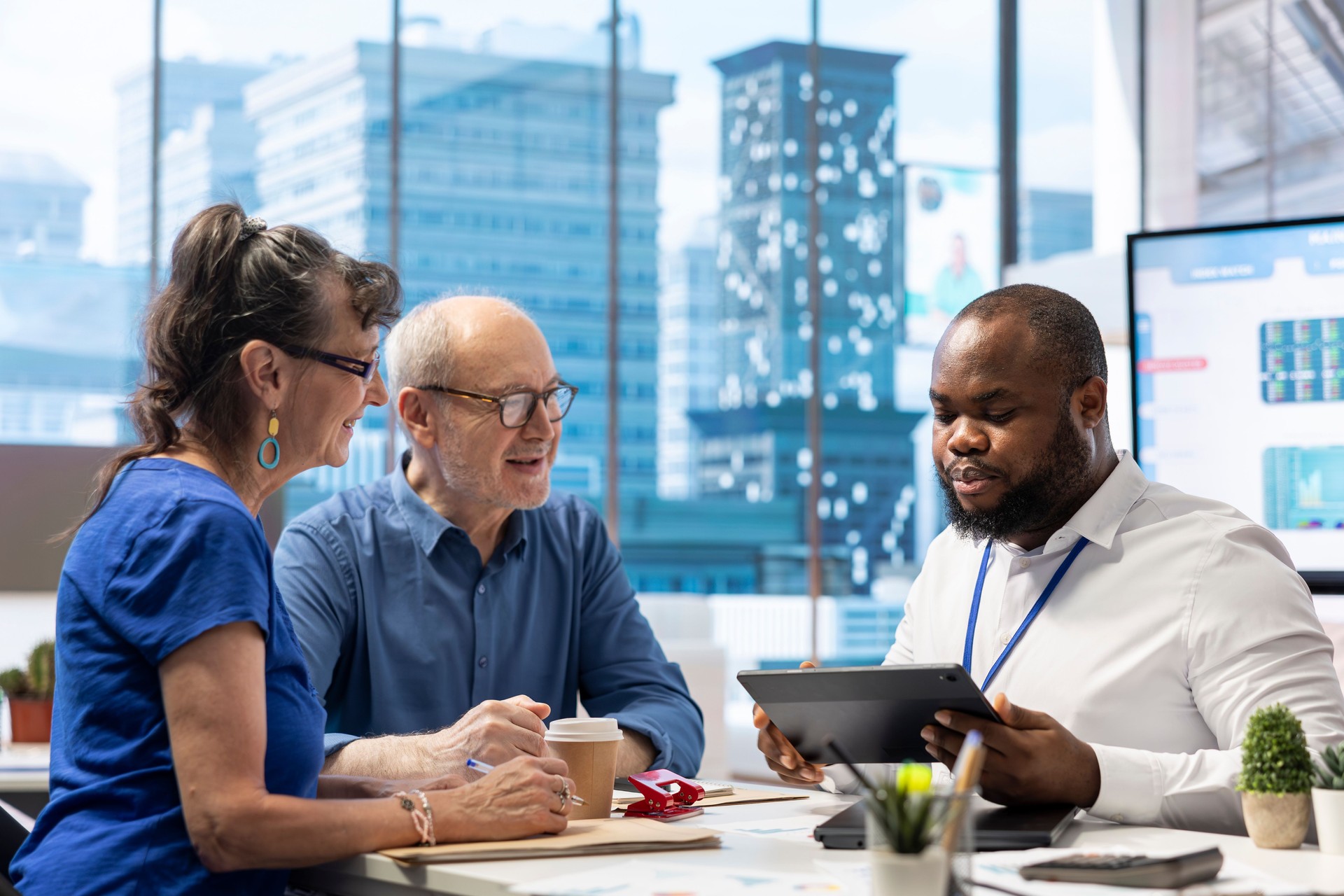 Senior people in consultation with financial expert to discuss retirement plans